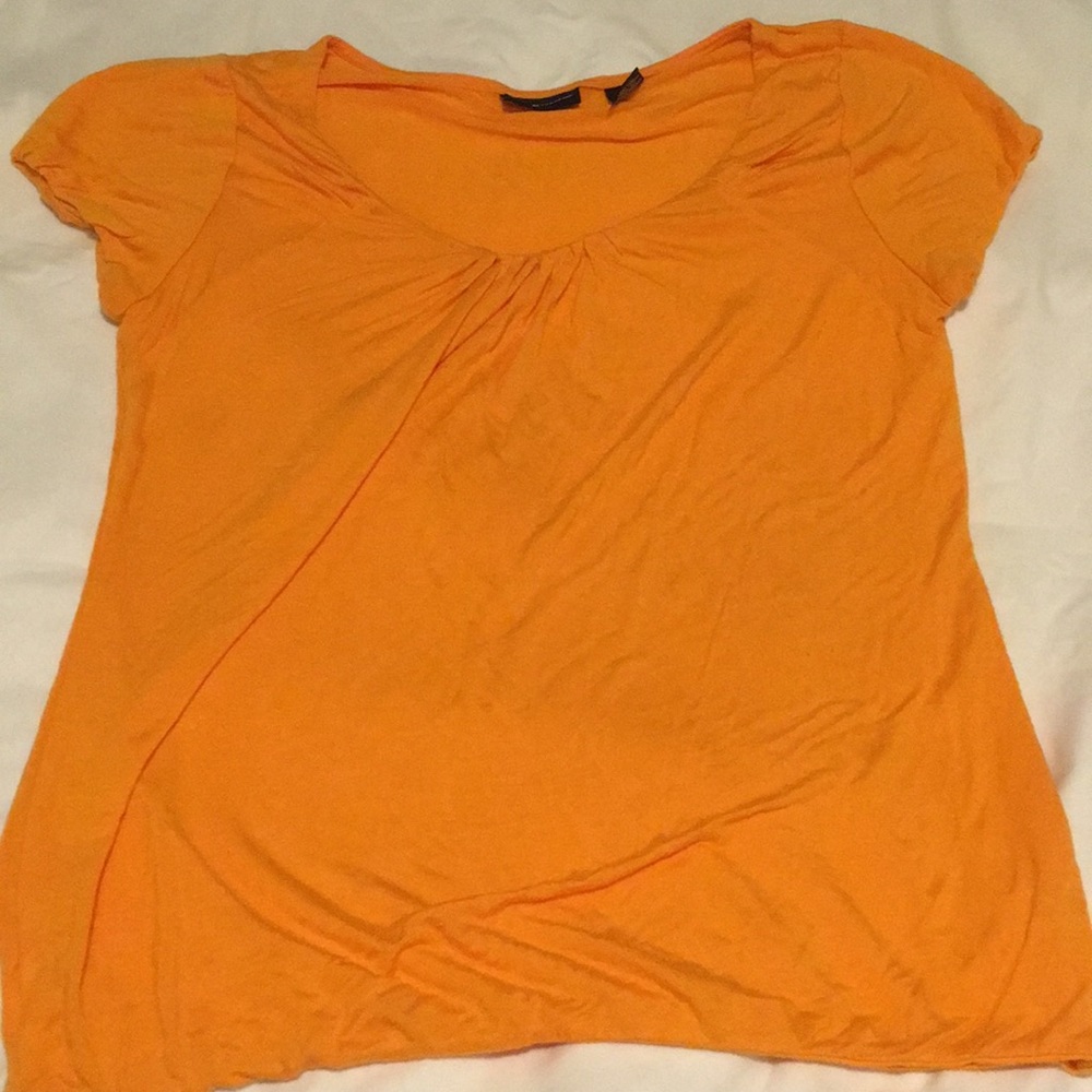 Bright orange tee.